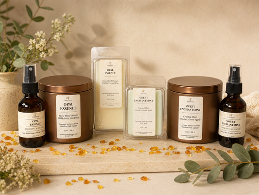 Collection of Opal Essence products including candles and bottles on a wooden surface with decorative elements.